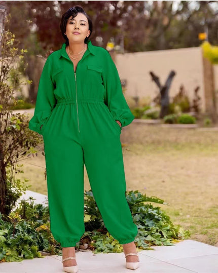 Green collared zip-front jumpsuit with long sleeves, gathered waist, cuffed tapered legs.