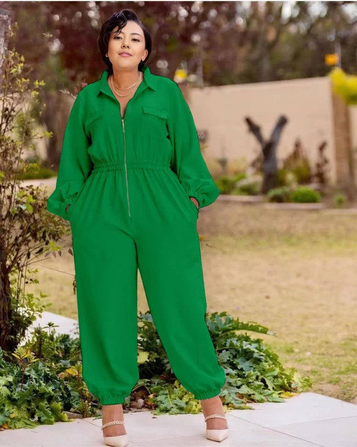 Green collared zip-front jumpsuit with long sleeves, gathered waist, cuffed tapered legs.