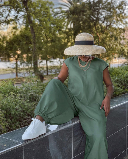 Olive-green wide-leg crew-neck jumpsuit with short sleeves and relaxed fit
