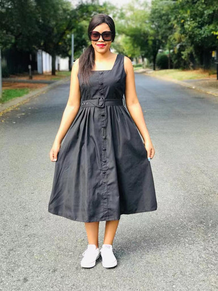 Black sleeveless midi dress with belted waist and button front