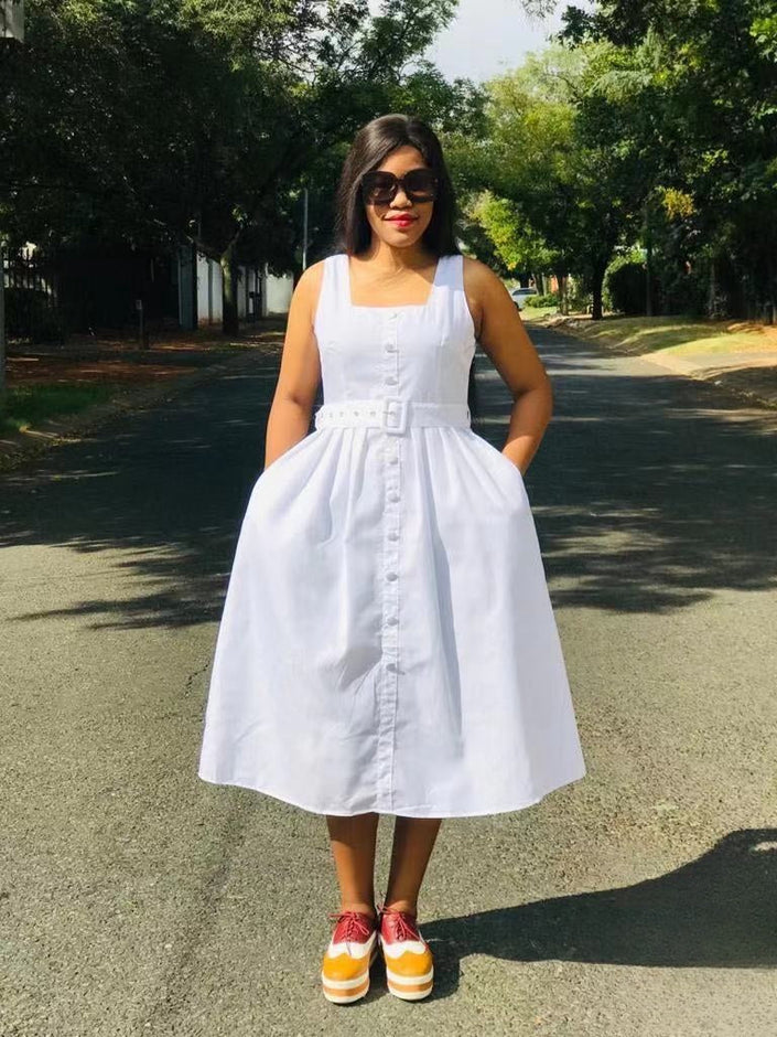 White sleeveless midi dress with belted waist and button front