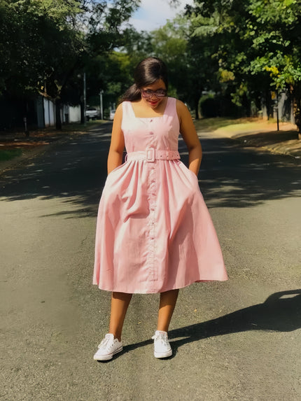 Pink sleeveless midi dress with belted waist and button front