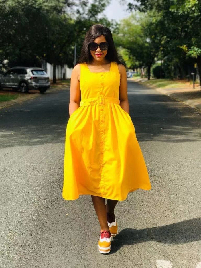 Yellow sleeveless midi dress with belted waist and button front