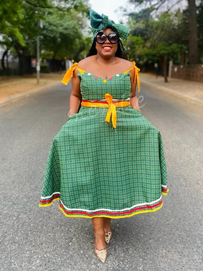 Green printed midi dress with tie-accent puff sleeves and tiered hem