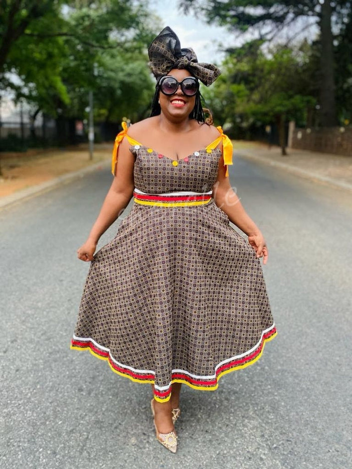 Brown printed midi dress with tie-accent puff sleeves and tiered hem