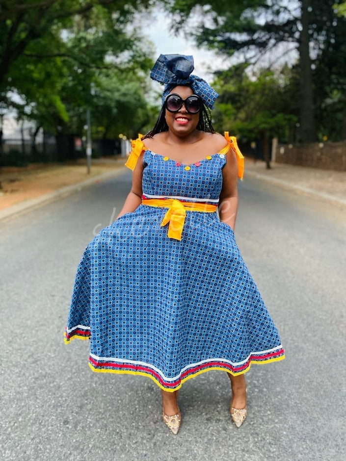 Blue printed midi dress with tie-accent puff sleeves and tiered hem