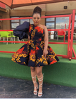 One-shoulder puff-sleeve dress, bold red/navy floral print, flared skirt