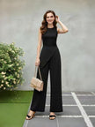 Black wide-leg pants with asymmetric diagonal front flap detail and wide flared legs