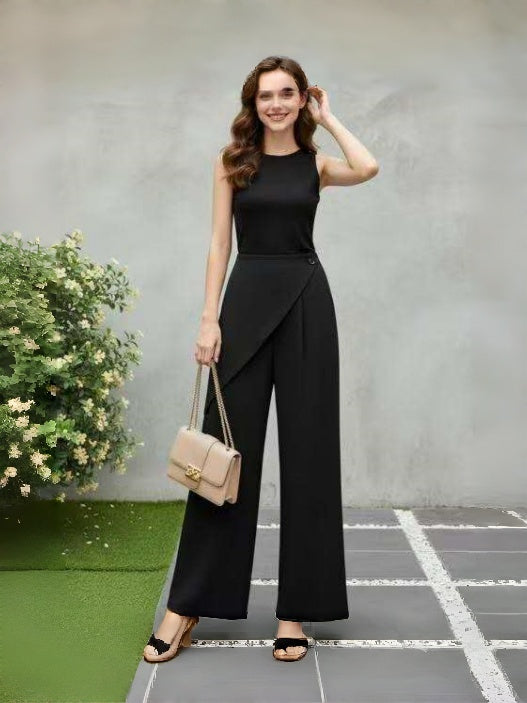 Black wide-leg pants with asymmetric diagonal front flap detail and wide flared legs