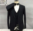 Dark single-breasted suit jacket with notched lapels, matching vest and bow tie