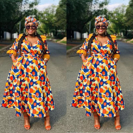 Ruffle sleeve dress in blue with multicolor geometric circle motif and tiered skirt