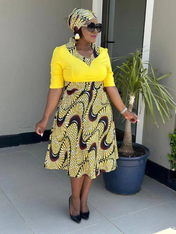 Yellow midi pleated African print dress with black maroon swirl panels
