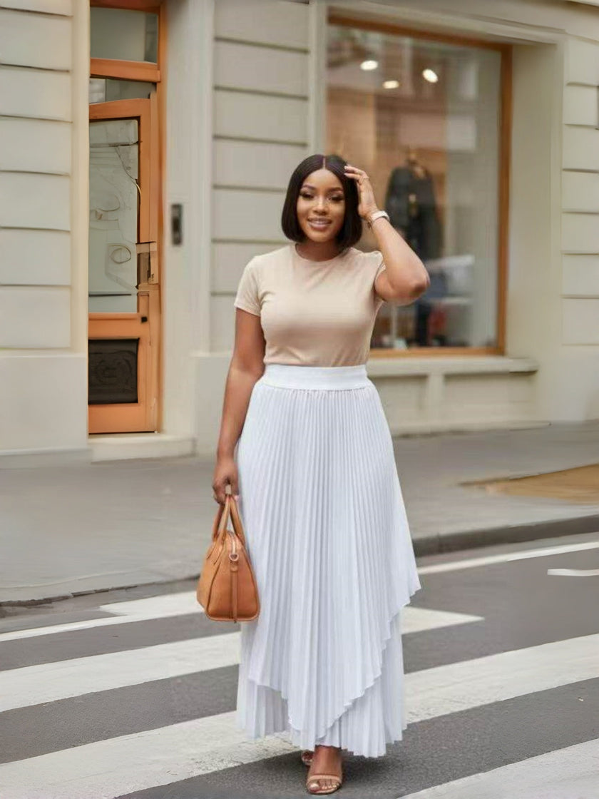 White pleated maxi skirt with asymmetrical layered hem, full length