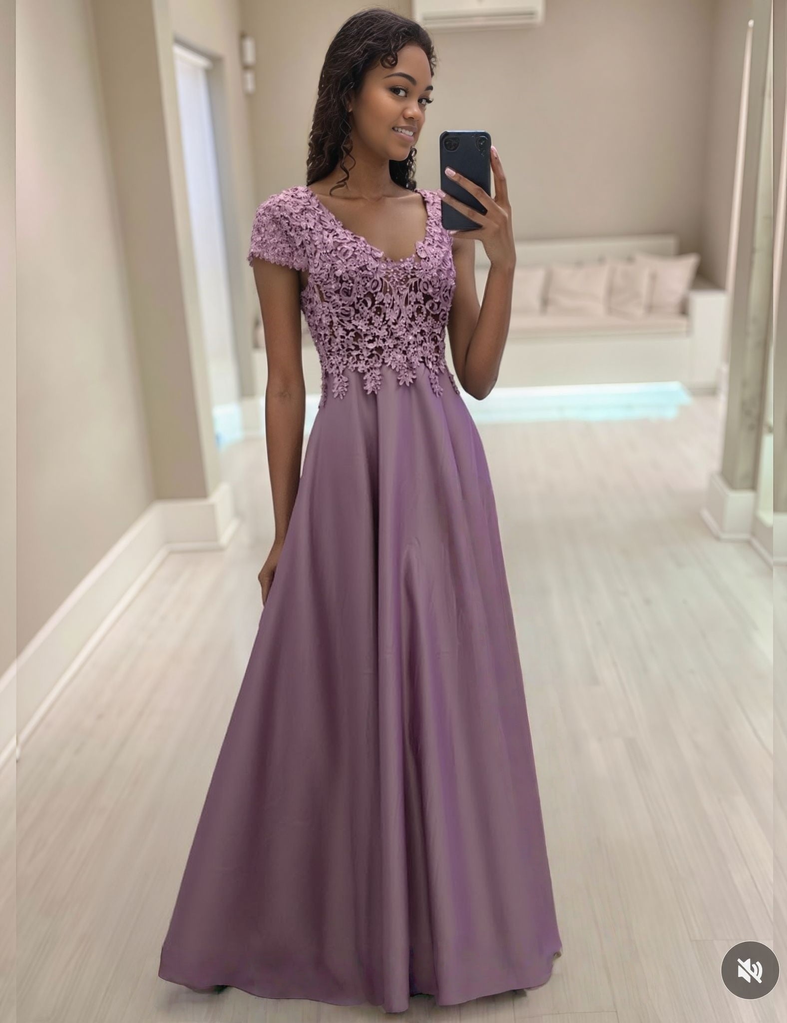 Floral evening dress with lace bodice, cap sleeves, and flowing mauve skirt