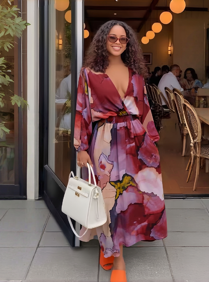 Floral maxi dress with deep V neckline and long puff sleeves, pink and purple pattern