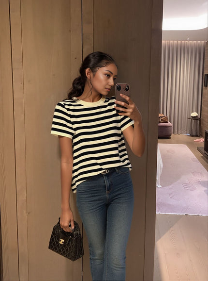 Black and cream striped knit top with short sleeves and crew neckline