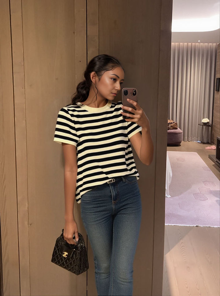 Black and cream striped knit top with short sleeves and crew neckline