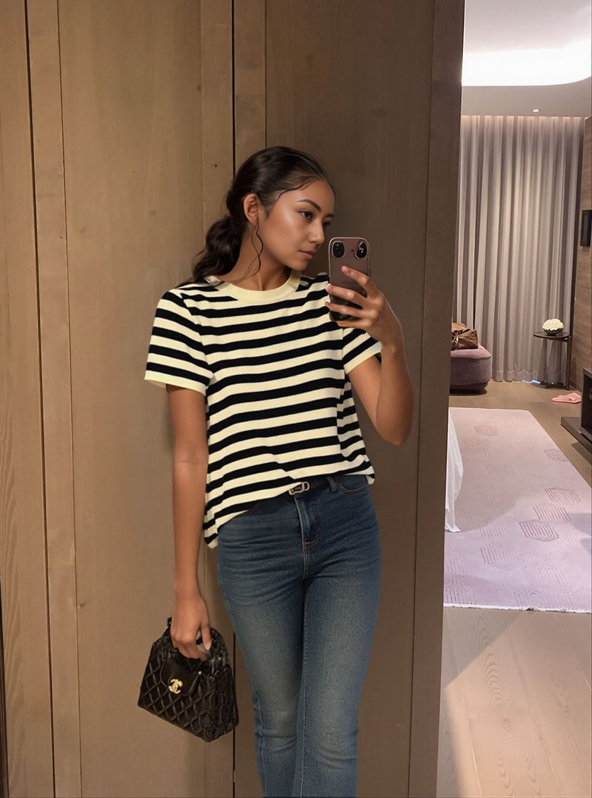 Black and cream striped knit top with short sleeves and crew neckline