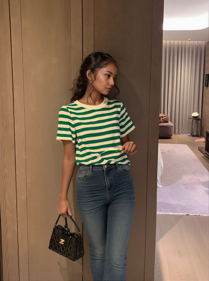 Green and cream striped knit top with short sleeves and crew neckline
