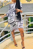 Newspaper print dress, white with black typography, V-neck and short hem