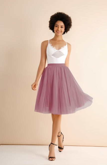 Light pink pleated midi skirt with stretch waistband, flared A-line silhouette
