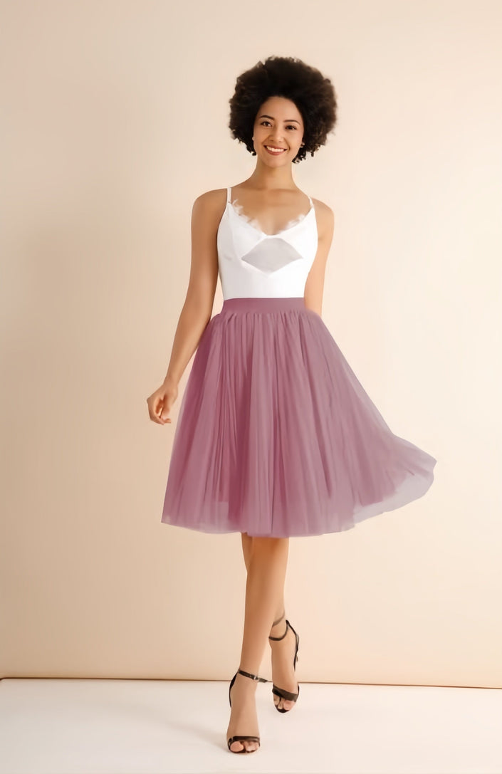 Light pink pleated midi skirt with stretch waistband, flared A-line silhouette