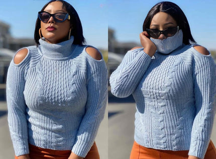 Light blue knit cold-shoulder sweater with high neck and cable pattern