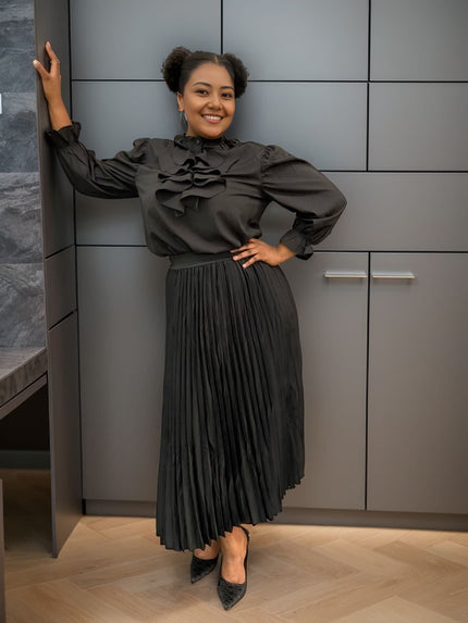 Black ruffle puff-sleeve blouse with layered high neckline