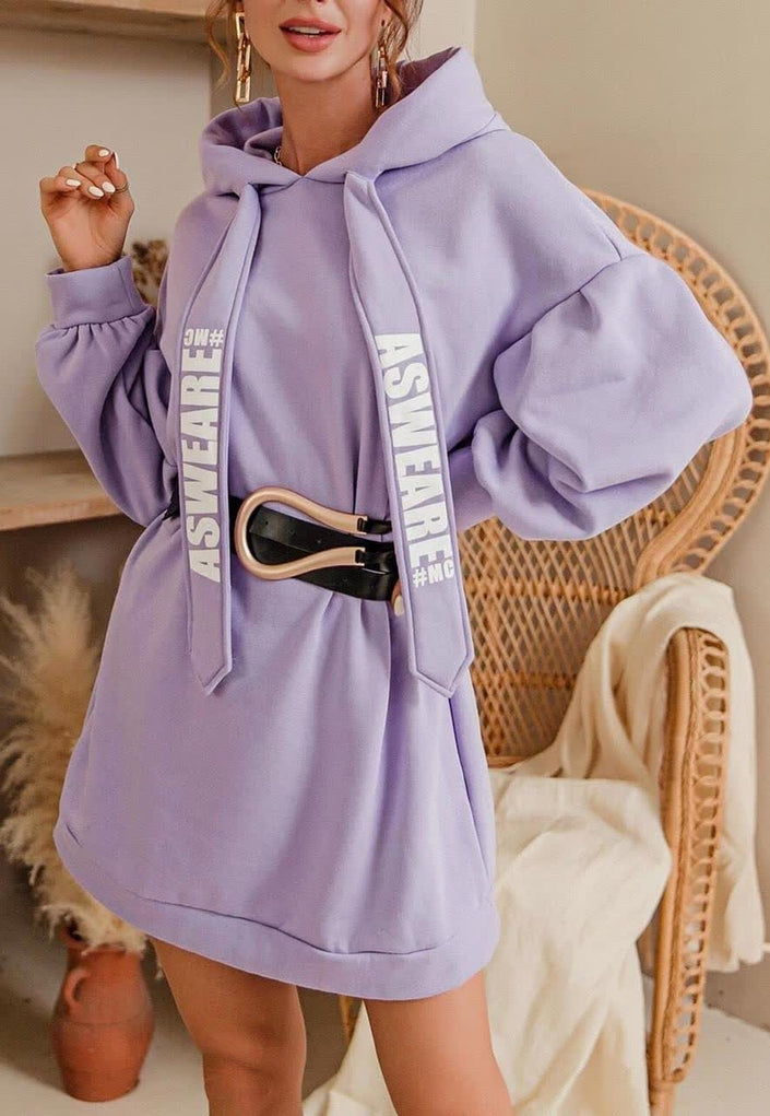 Oversized hoodie dress in light purple with front pocket and drawstring hood.