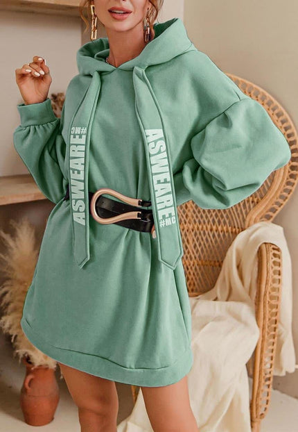 Oversized hoodie dress in light sea green with front pocket and drawstring hood.