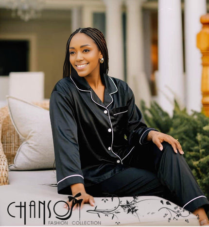 Black satin pajama set with white piping: button shirt and straight pants