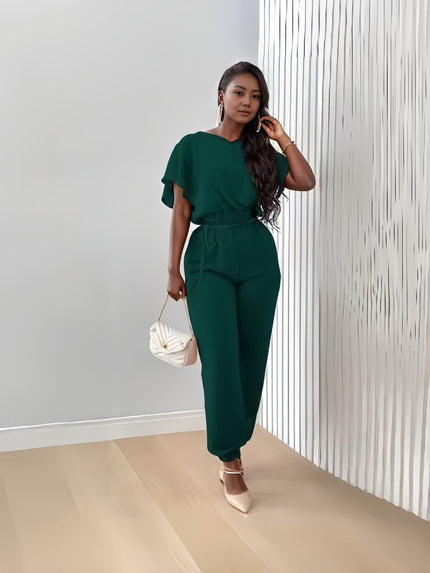 Dark green stretch twin set with short-sleeve top and tapered jogger pants, tie waist