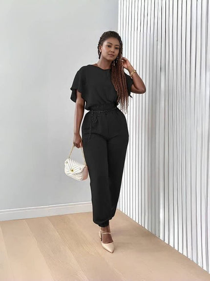 Black stretch twin set with short-sleeve top and tapered jogger pants, tie waist