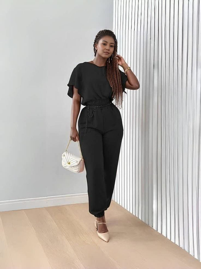 Black stretch twin set with short-sleeve top and tapered jogger pants, tie waist