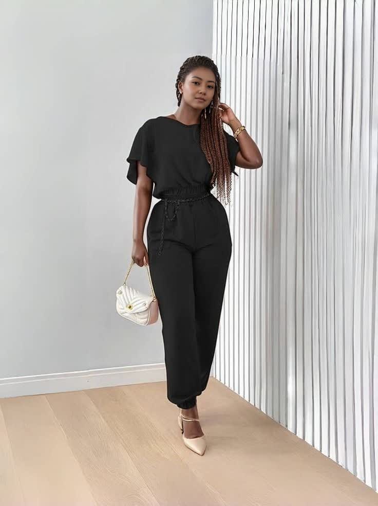 Black stretch twin set with short-sleeve top and tapered jogger pants, tie waist
