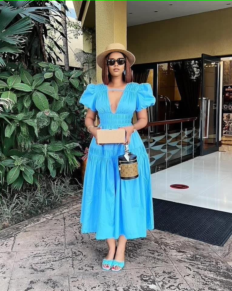 Sky-blue puff sleeve tiered maxi dress with deep V-neck and elastic bodice
