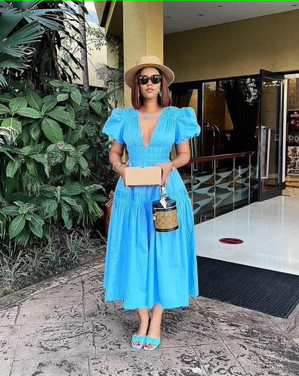 Sky-blue puff sleeve tiered maxi dress with deep V-neck and elastic bodice