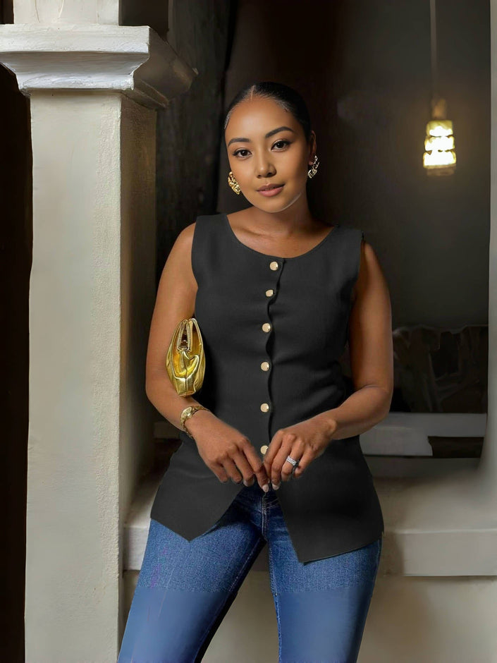 Black sleeveless button top with split hem and curved peplum hem