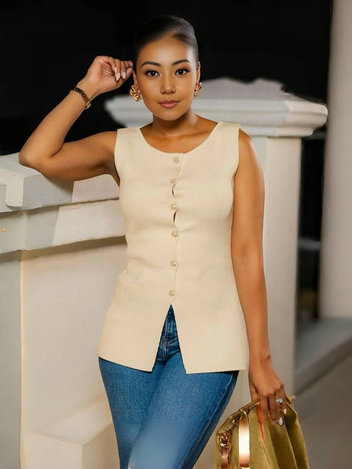 Nude sleeveless button top with split hem and curved peplum hem