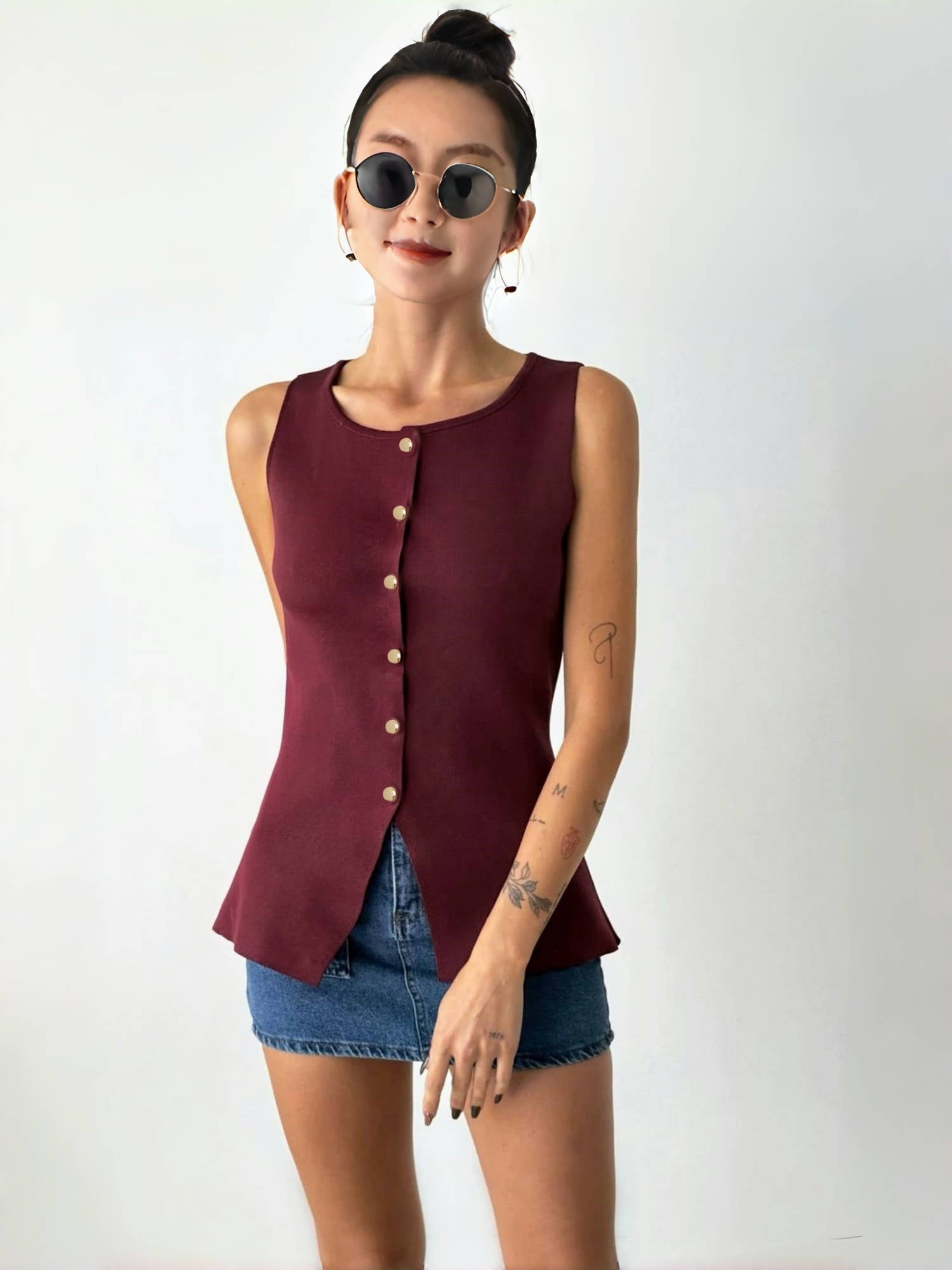 Maroon sleeveless button top with front buttons and split hem peplum