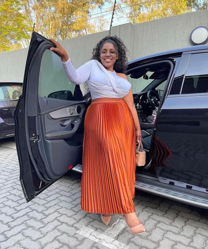 Orange-red pleated midi skirt with elastic stretch waistband