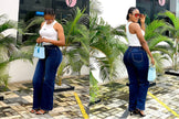 High-waist slim-fit dark blue jeans with straight legs and belt loops