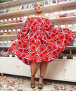 Red off-shoulder puff sleeve midi dress with white circular pattern, wide A-line skirt.