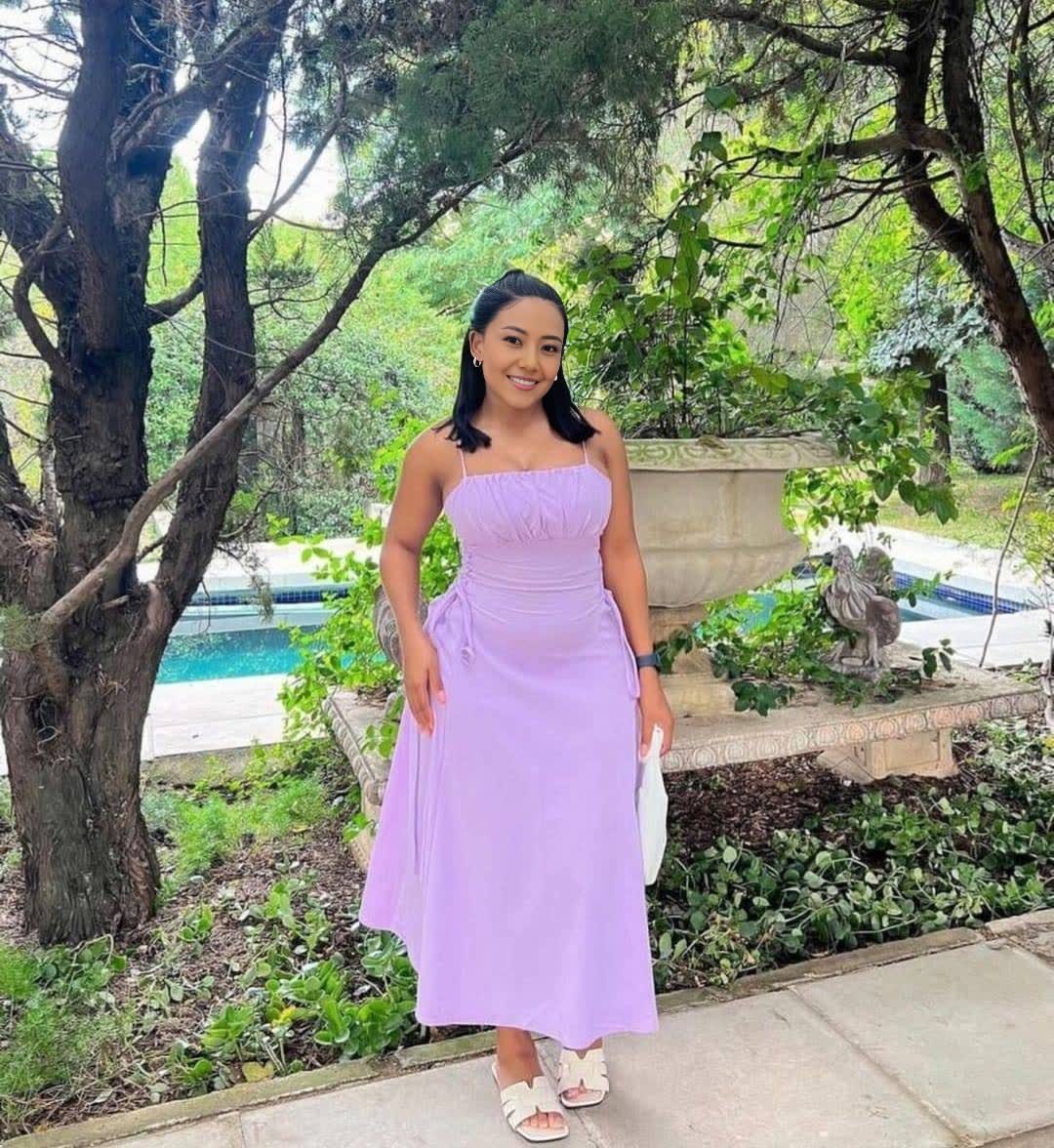 Light-purple midi dress with spaghetti straps, ruched top, and adjustable drawstring waist