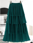 Dark green layered pleated skirt with elastic waistband and tiered ruffles