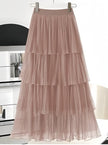 Peach layered pleated skirt with elastic waistband and tiered ruffles