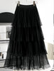 Black layered pleated skirt with elastic waistband and tiered ruffles