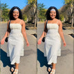 White midi dress with spaghetti straps, ruched bodice, and adjustable drawstring waist ties