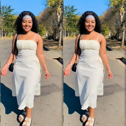 White midi dress with spaghetti straps, ruched bodice, and adjustable drawstring waist ties