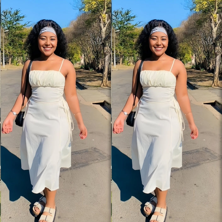 White midi dress with spaghetti straps, ruched bodice, and adjustable drawstring waist ties